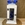 Candelabro blanco con flores en tonos azules - Imagen 1