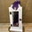 Candelabro blanco con flores en tonos lilas - Imagen 1
