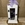 Candelabro blanco con flores en tonos morados - Imagen 1