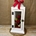 Candelabro blanco con flores en tonos rojos - Imagen 1