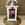 Candelabro blanco pequeño con flores en tonos rosa - Imagen 1